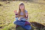 Little girl in yoga pose free image download